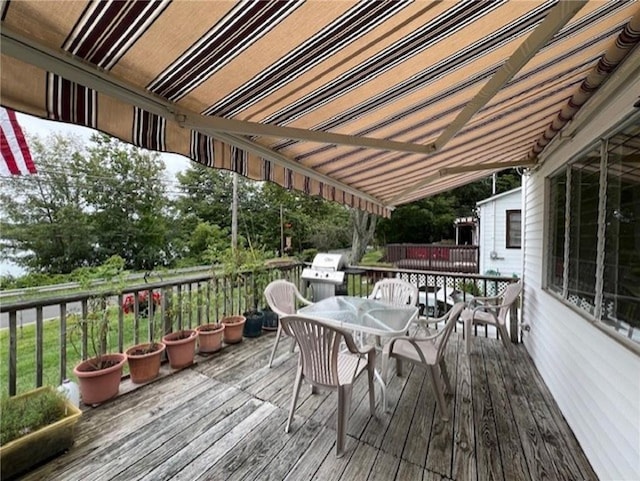 wooden terrace featuring grilling area