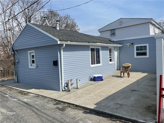 back of property with a patio