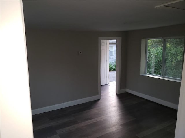 empty room featuring dark hardwood / wood-style floors