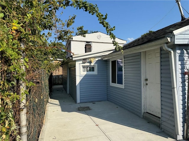 view of property exterior with a patio area