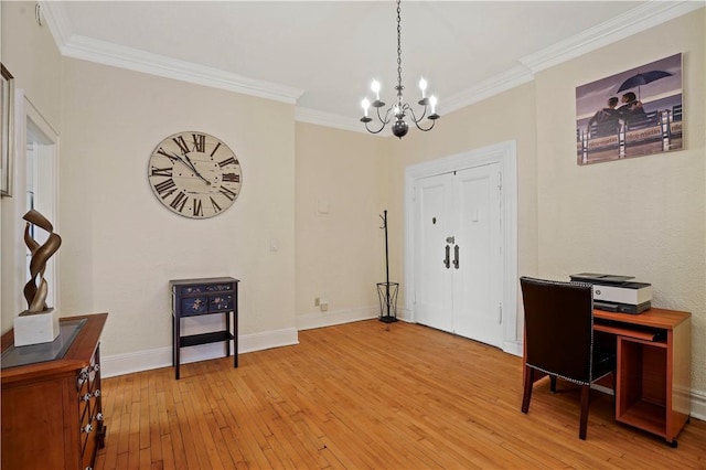 home office with baseboards, light wood-type flooring, an inviting chandelier, and crown molding