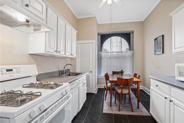 kitchen with white appliances, white cabinets, ornamental molding, under cabinet range hood, and a sink