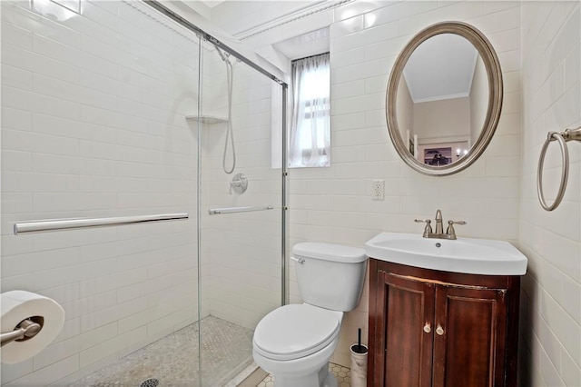 full bath featuring toilet, a stall shower, tile walls, and vanity