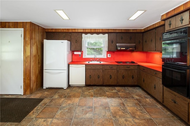 kitchen with dark brown cabinets, sink, backsplash, and black appliances