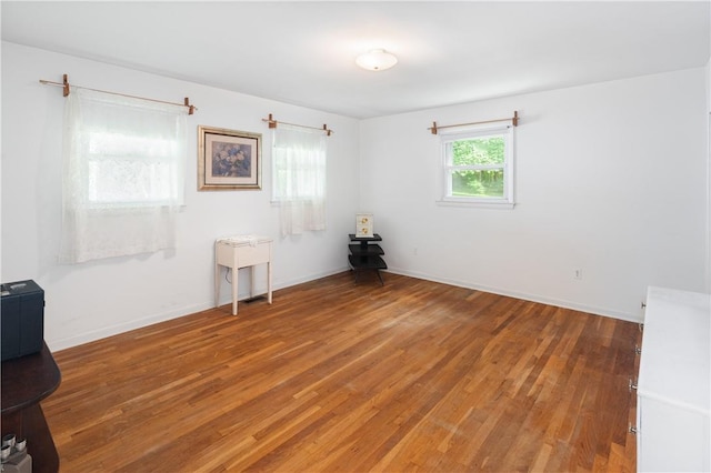 empty room with wood-type flooring