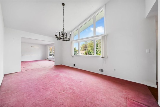 interior space featuring an inviting chandelier, carpet floors, and high vaulted ceiling