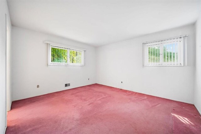 empty room with carpet flooring