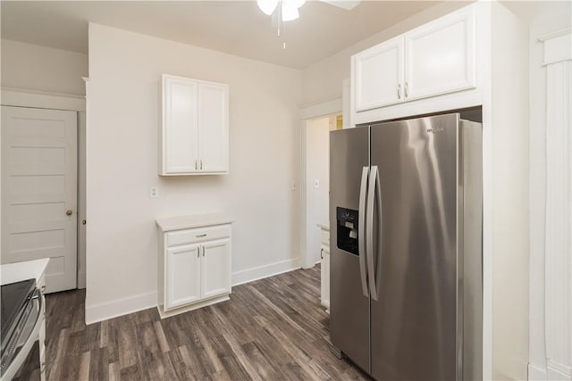 kitchen with dark hardwood / wood-style flooring, white cabinets, and stainless steel appliances