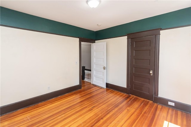 unfurnished bedroom featuring wood-type flooring