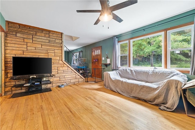 living room with ceiling fan and hardwood / wood-style flooring