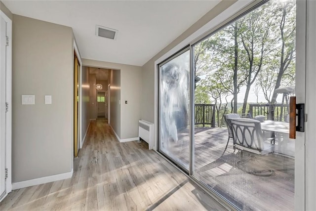 entryway featuring radiator and light wood-type flooring