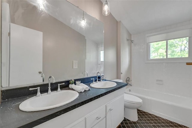 full bathroom with vanity, toilet, lofted ceiling, and bathing tub / shower combination