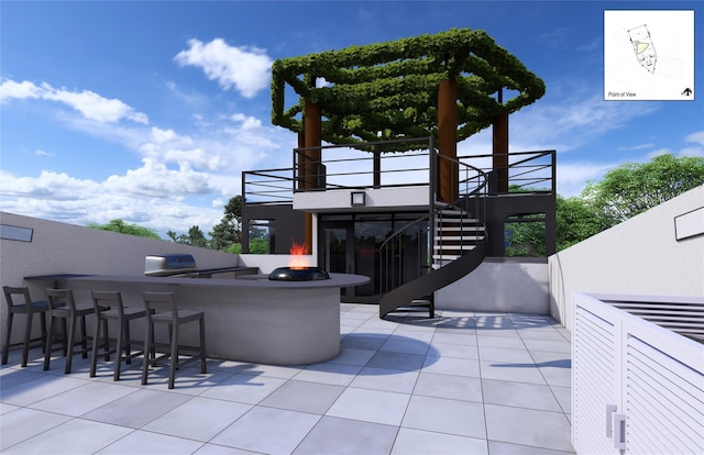 view of patio / terrace with a fire pit and exterior bar