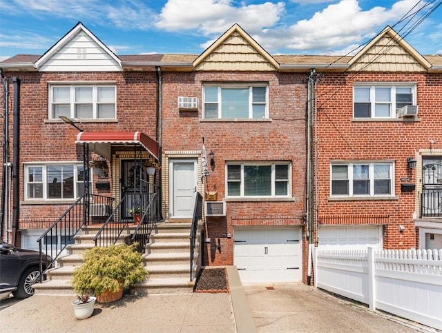 townhome / multi-family property featuring a garage