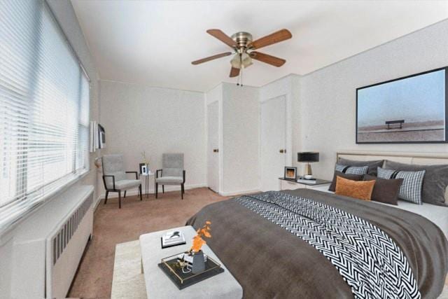 carpeted bedroom featuring radiator and ceiling fan