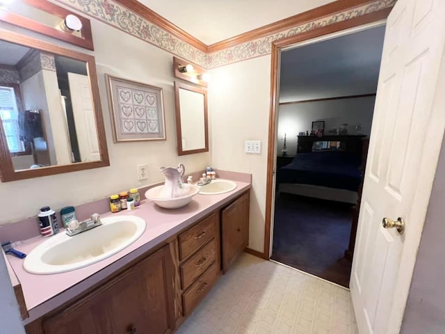 bathroom with vanity and ornamental molding