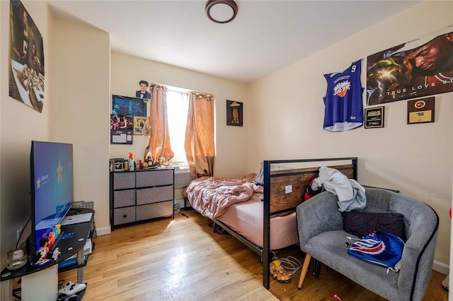 bedroom with light hardwood / wood-style floors