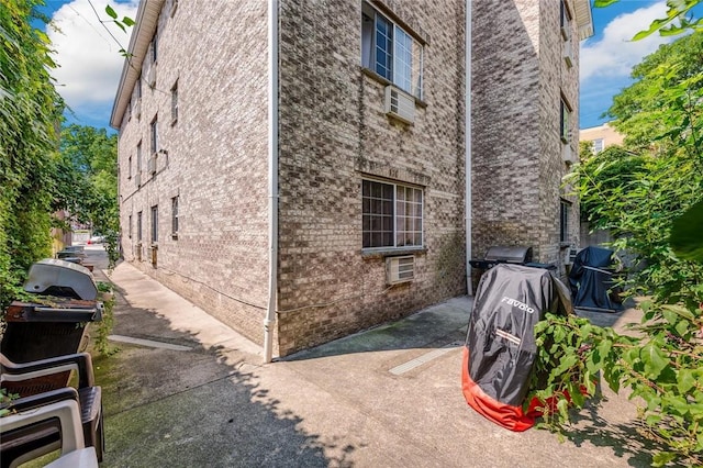 view of side of home featuring a patio area