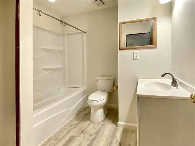 full bathroom with vanity,  shower combination, toilet, and wood-type flooring