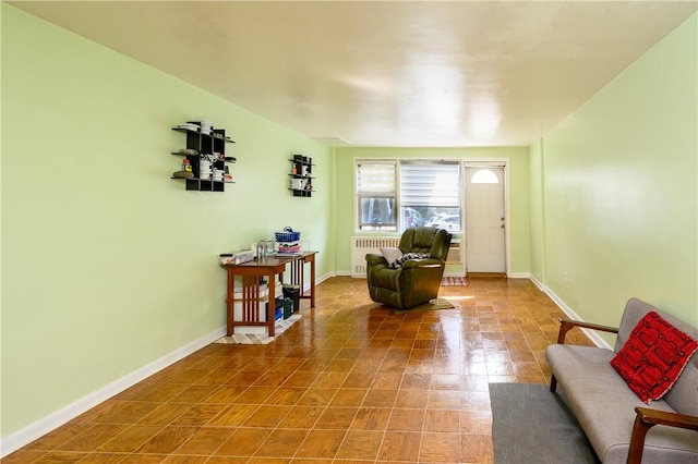 sitting room with tile patterned flooring and radiator heating unit