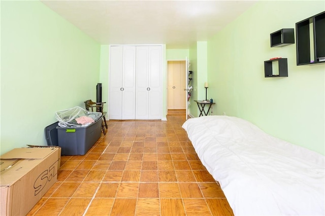 tiled bedroom with a closet