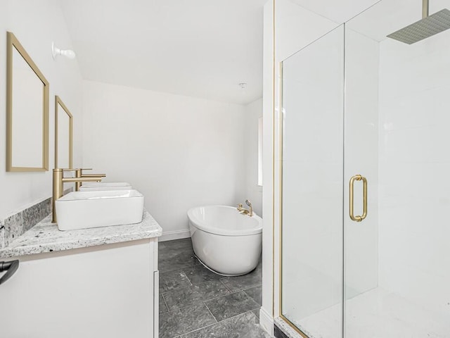 bathroom featuring vanity and shower with separate bathtub