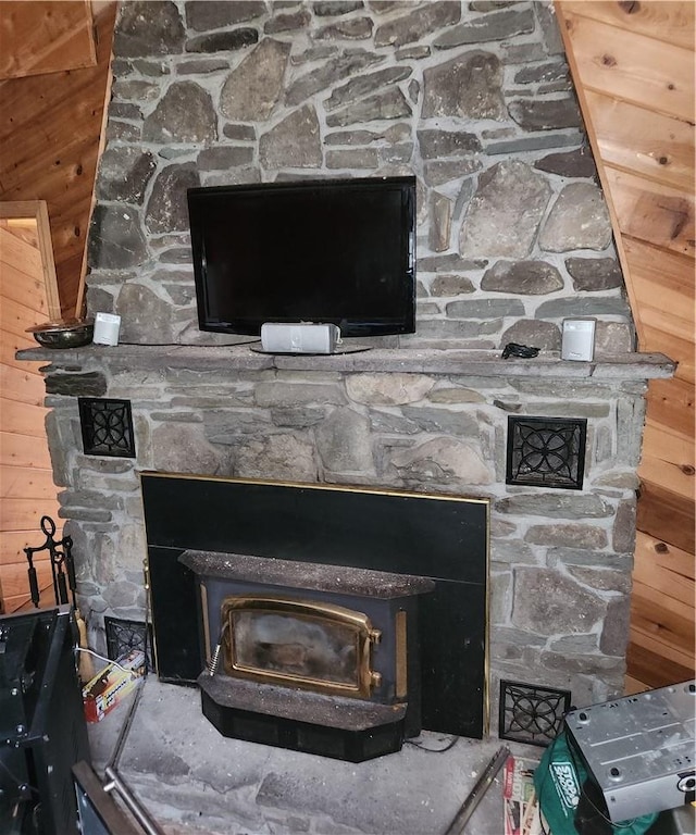 details with a wood stove and wooden walls