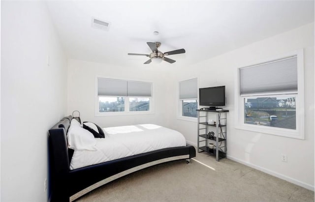 carpeted bedroom with ceiling fan