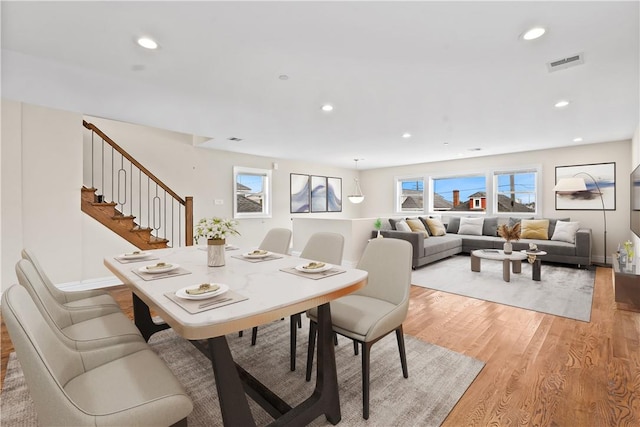 dining area featuring light hardwood / wood-style flooring and a healthy amount of sunlight