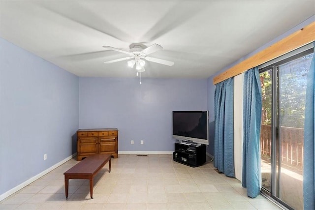 living area with ceiling fan