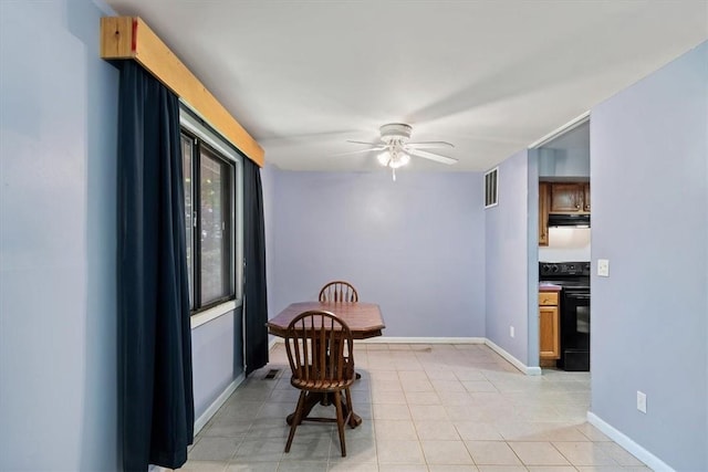 dining room with ceiling fan and light tile patterned flooring