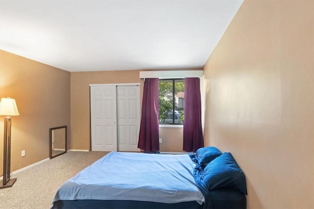 bedroom featuring a closet and carpet floors