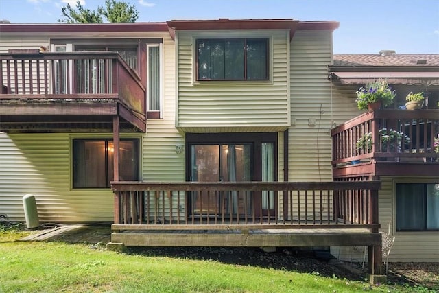 rear view of property with a balcony