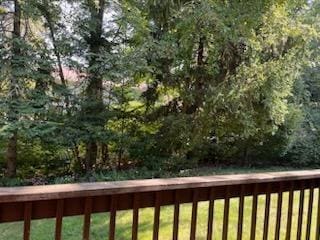 wooden deck featuring a yard