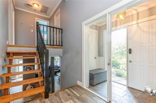 entryway featuring ornamental molding