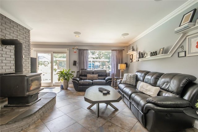 living room featuring light tile patterned floors, a wood stove, plenty of natural light, and crown molding