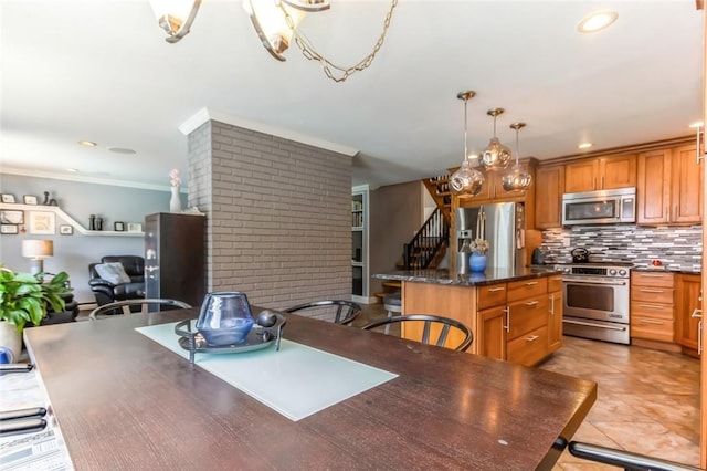 dining space with crown molding, light tile patterned floors, and a chandelier