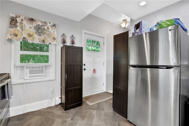 kitchen featuring dark brown cabinets, cooling unit, a healthy amount of sunlight, and appliances with stainless steel finishes