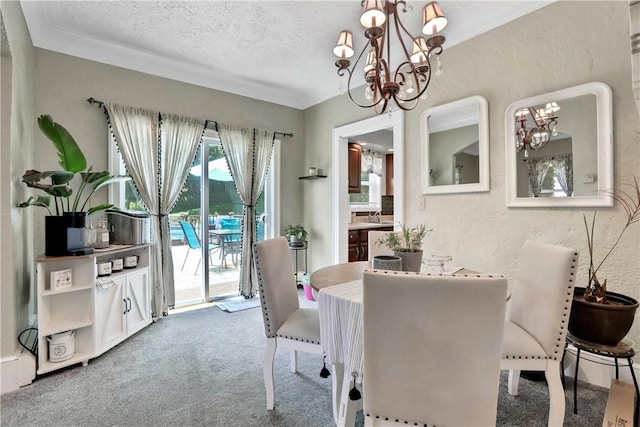 carpeted dining area featuring sink, a textured ceiling, and an inviting chandelier