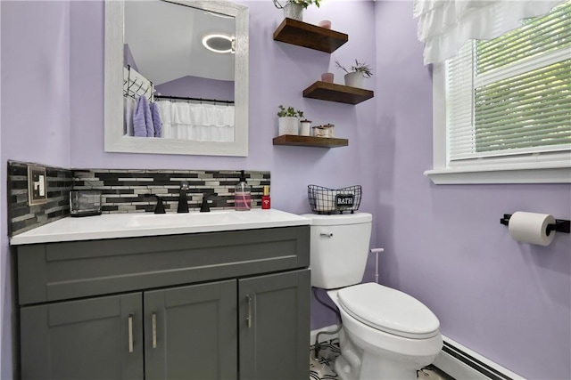 bathroom featuring tasteful backsplash, vanity, a baseboard radiator, toilet, and lofted ceiling