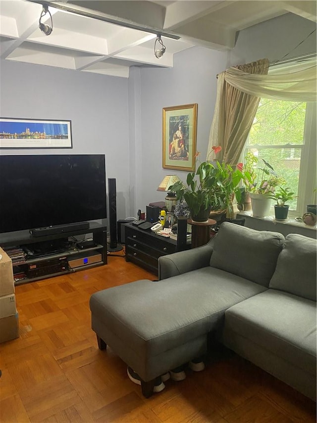 living room featuring beam ceiling and parquet flooring