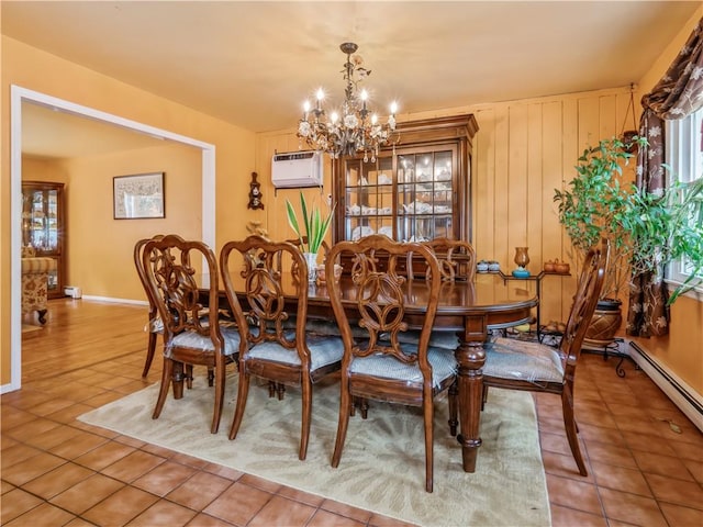 dining space featuring an AC wall unit, tile patterned flooring, a baseboard radiator, and an inviting chandelier