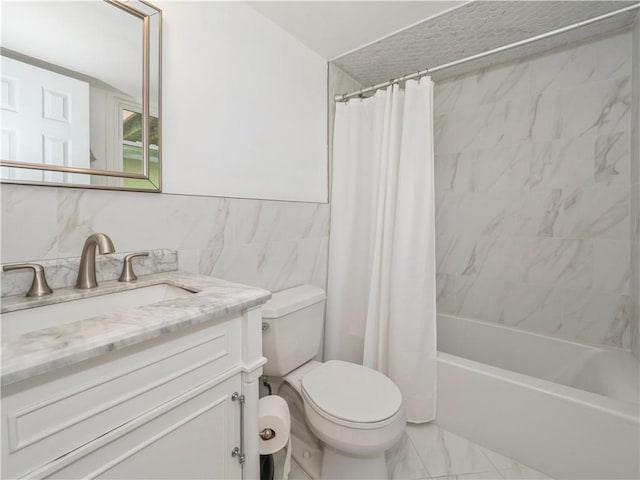 full bathroom with shower / bath combo with shower curtain, vanity, tile walls, and toilet