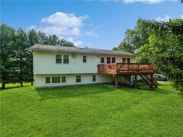 back of property featuring a lawn and a wooden deck