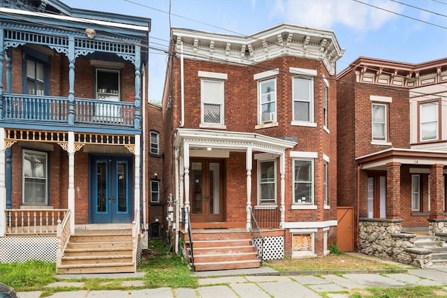 italianate house with a porch and a balcony