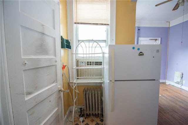 utility room featuring radiator