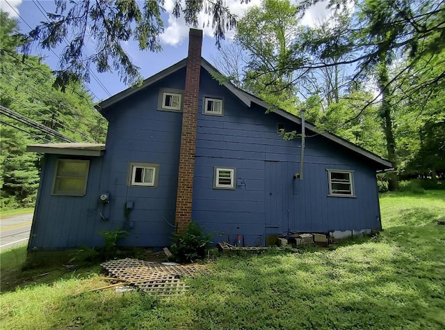 1131 County Route 31, Glen Spey, NY 12737 - view of home's exterior with a chimney and a yard