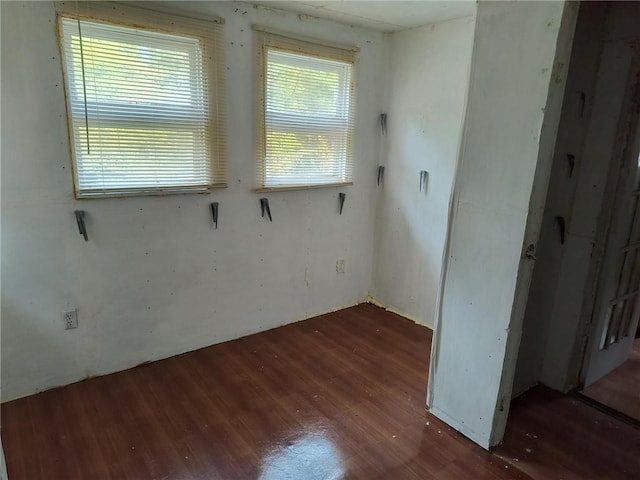 empty room with dark wood-type flooring