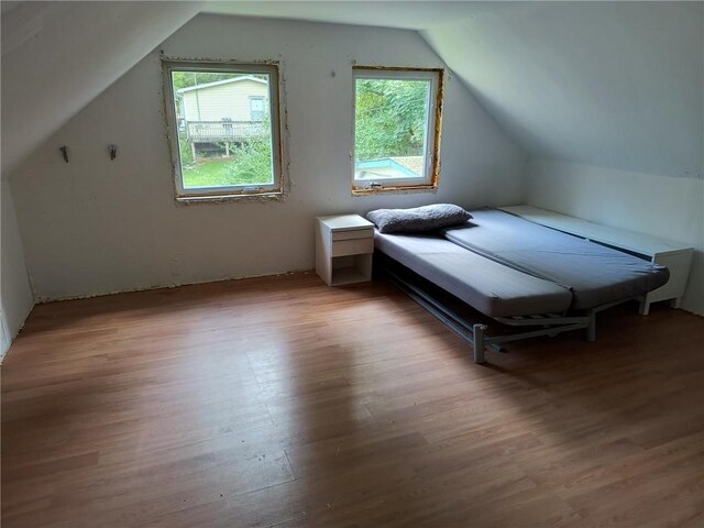 1131 County Route 31, Glen Spey, NY 12737 - bedroom featuring multiple windows, lofted ceiling, and wood finished floors