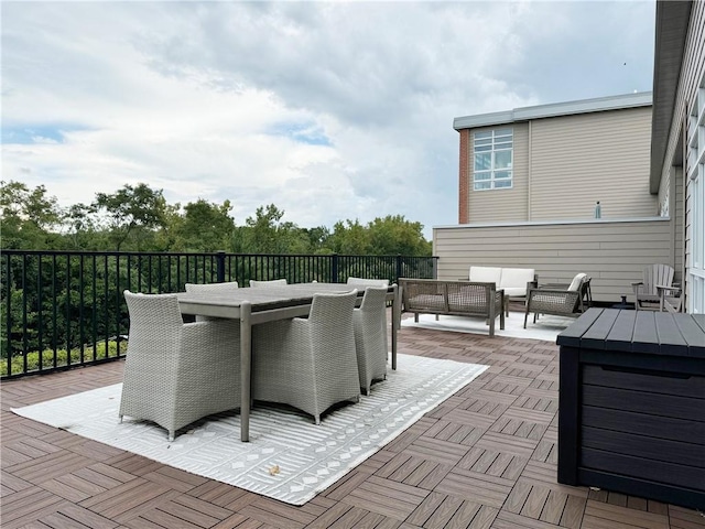 wooden terrace with outdoor lounge area